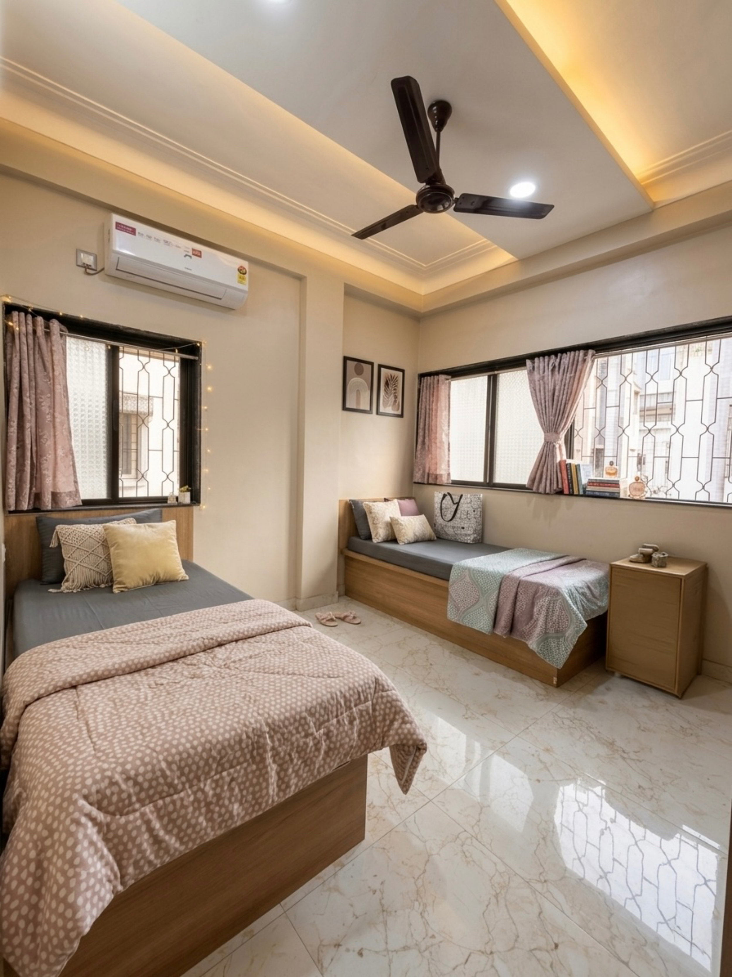 Spacious girls hostel PG room with natural lighting Kalyani Nagar